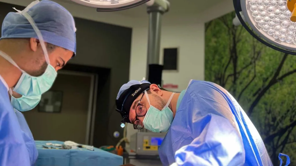 dr erman ak during Deep Plane Facelift surgery in Istanbul Deep Plane Facelift